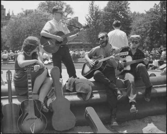 History of Greenwich Village Folk Music Bearded guitarist with other musicians, Washington Square Park