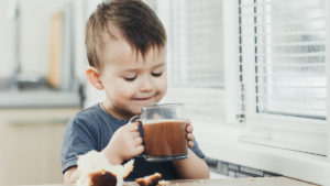 kid drinking hot chocolate